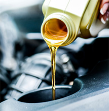 New oil is poured into a car engine in Pompano Beach