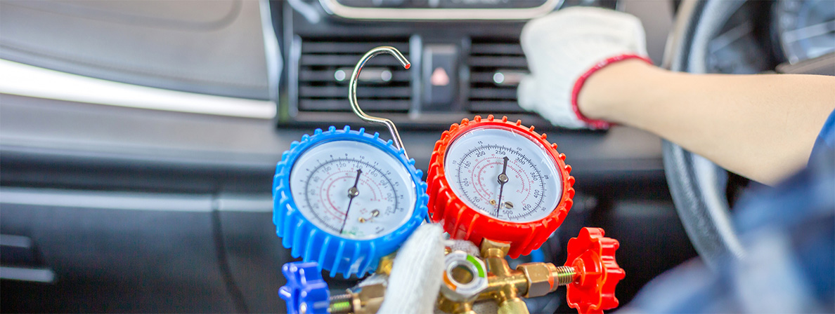 A blue and red gauge check the air flow after air conditioning repair in Pompano Beach
