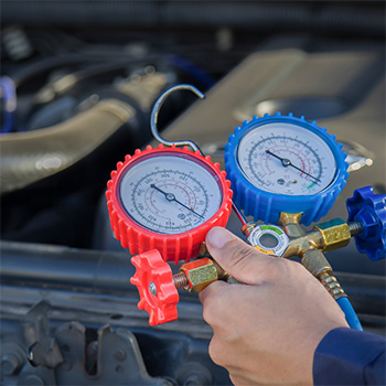 Gauges display results of air conditioning repair by EF Tire & Auto Repair in Pompano Beach