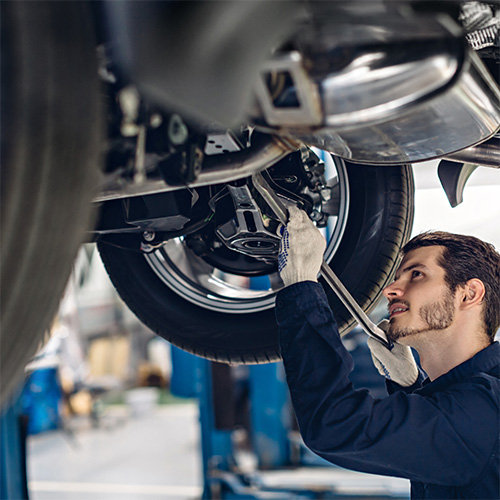Mechanic adjusts suspension and steering in Pompano Beach